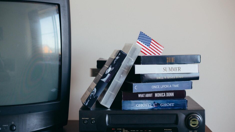 vhs tapes on top of a vhs player