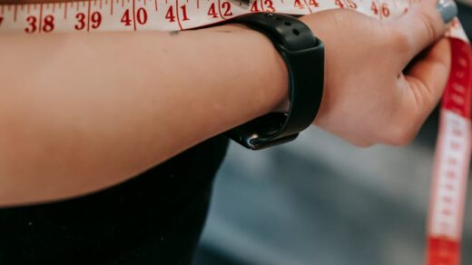 woman measuring her belly