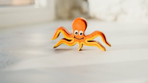 shallow focus photo of wooden octopus toy