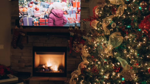 room with tv fireplace and christmas tree