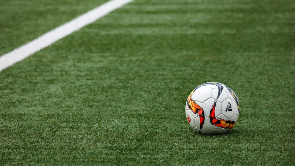 white adidas soccer ball on grass