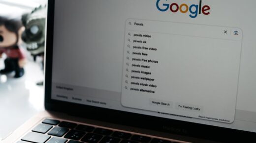 photo of a laptop screen with google main page on it