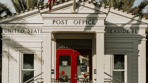 us a flag on white concrete building during daytime